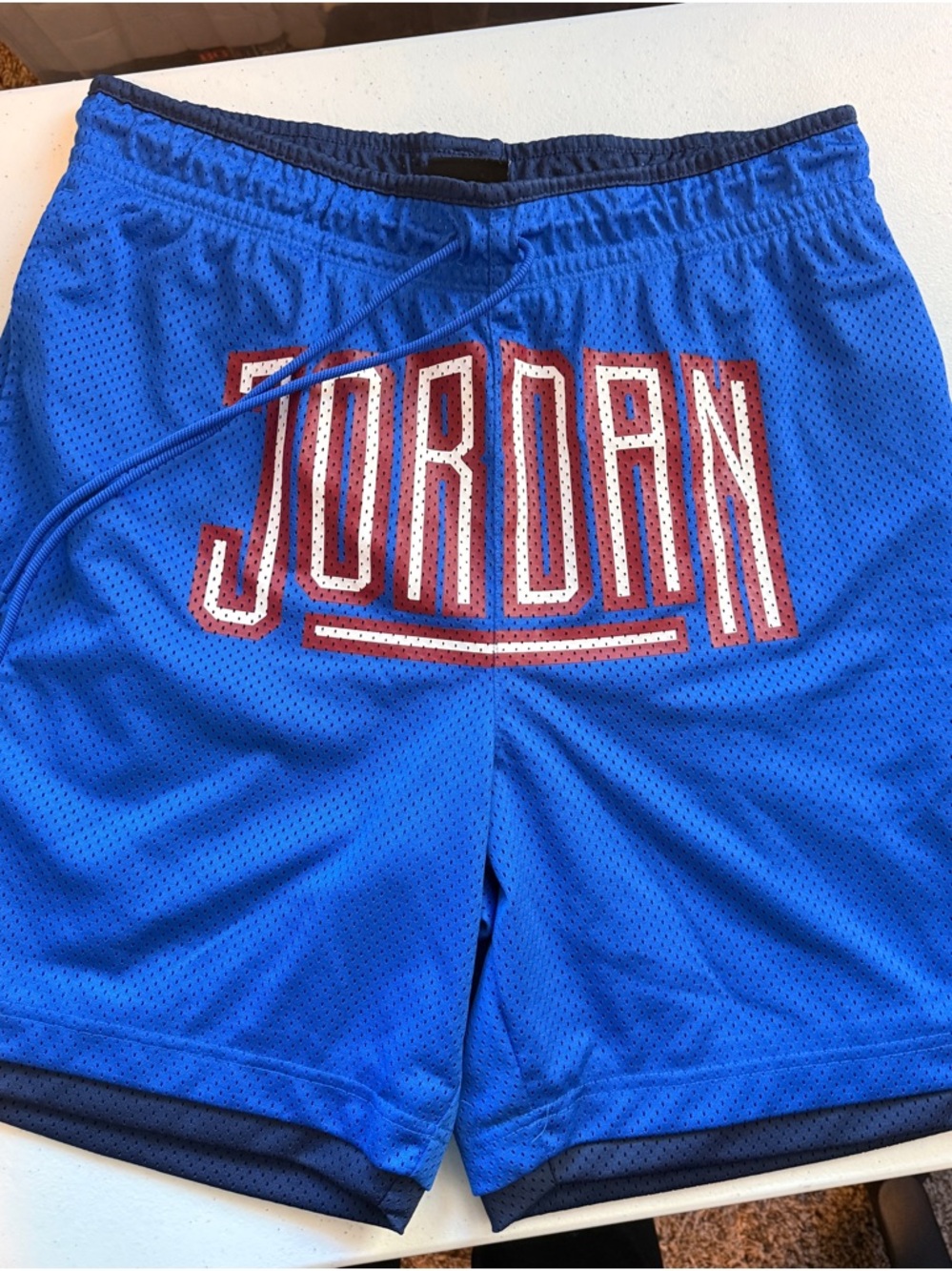 Jordan Blue Mesh Shorts with Red Jumpman Logo